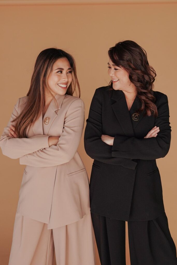 The founders’ confident posture reflects the mission to help clients gain clarity and confidence in presenting their brand online.